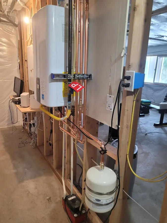 Licensed plumber repairing a kitchen sink in Spanaway