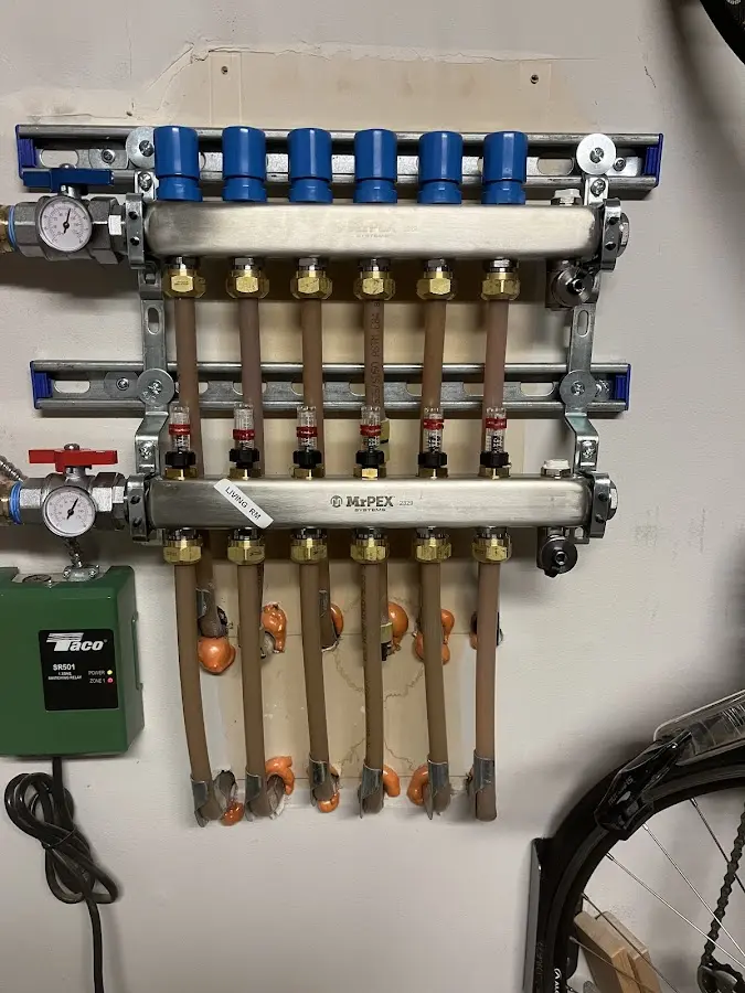 Plumber performing Water Heater Repair at a residential property in Spanaway